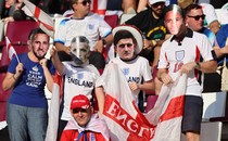 England fans wear masks of players ahead of the team's November 21 match against Iran