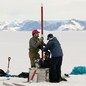 Scientists drilling into the arctic.