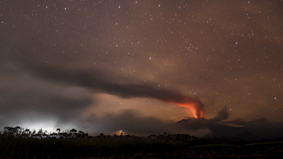 Mount Raung, a volcano in Indonesia, erupts at night.