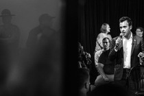 A black-and-white photo of Vivek Ramaswamy speaking at an event in Springfield, Ohio