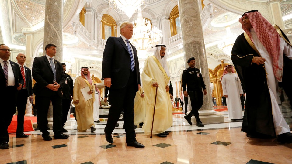 President Trump walks with Saudi Arabia's King Salman bin Abdulaziz Al Saud to deliver remarks to the Arab Islamic American Summit on May 21, 2017.