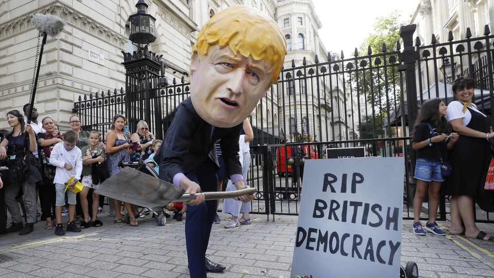 Protester in Boris Johnson mask