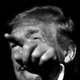 Donald Trump points a finger into the distance.