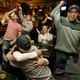 Boston baseball fans cheer while watching a Yankees–Red Sox game in 2004.