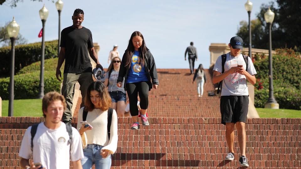 Students walking down steps on campus