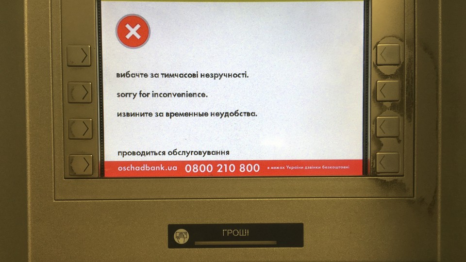 A virus-infected screen at Ukraine’s OshchadBank that says “sorry for the inconvenience/under repair” in Kiev on June 28, 2017. 