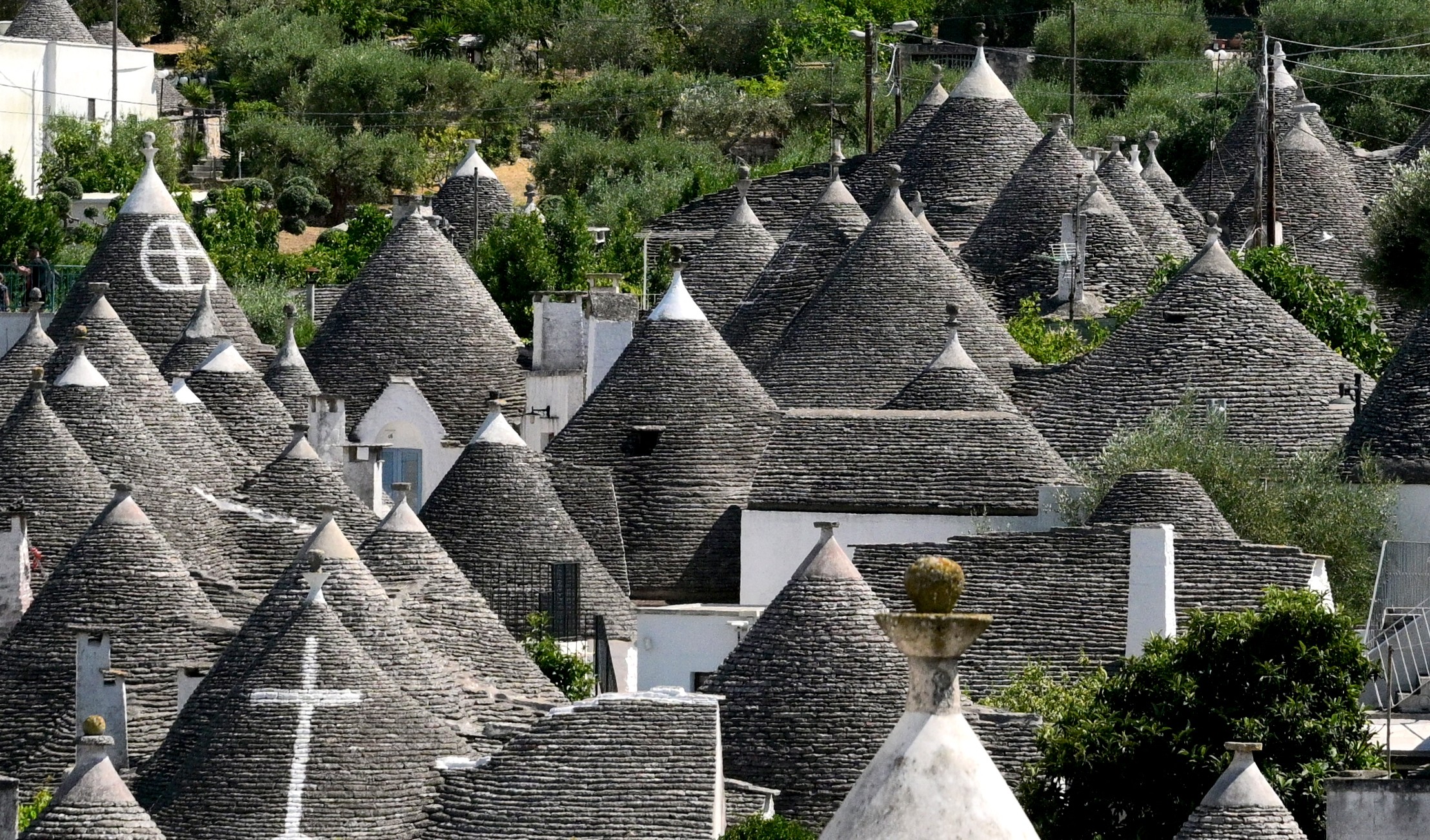 A view of historic dry-stone houses with conical stone roofs in Italy