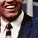 A close-up video of a man laughing