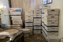 In a handout photo provided by the U.S. Department of Justice, stacks of boxes are seen in a bathroom and shower in the Mar-a-Lago Club’s Lake Room at former President Donald Trump’s estate in Palm Beach, Florida.