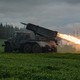 A rocket is launched from a truck-mounted multiple-rocket launcher.