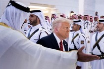 A news photo of Donald Trump at a formal ceremony in the Middle East