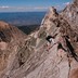 A woman climbing Capitol Peak's Knife Edge 