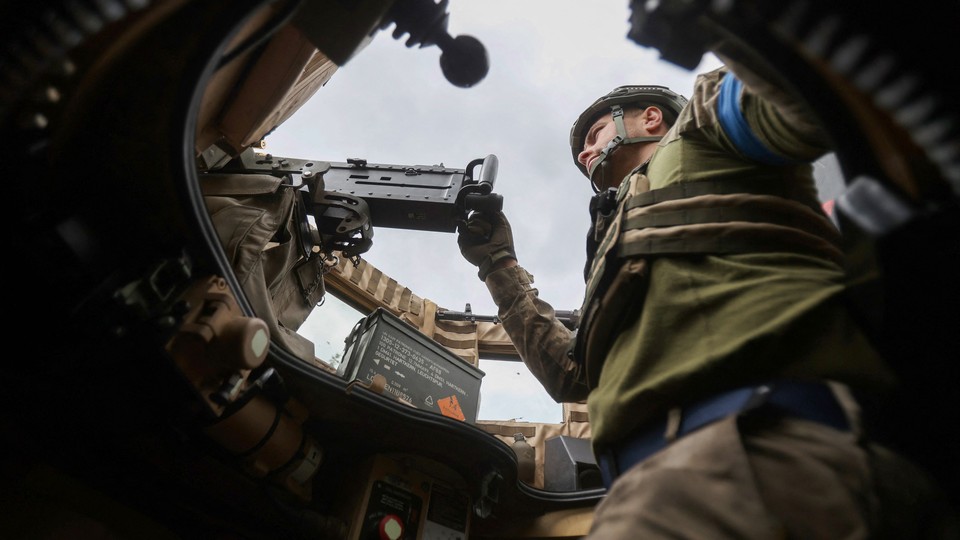 A soldier in a combat vehicle
