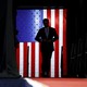 The silhouette of J. D. Vance in front of an illuminated American flag