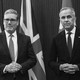 A black and white photograph of Keir Starmer and Mark Carney standing with their hands in front of them