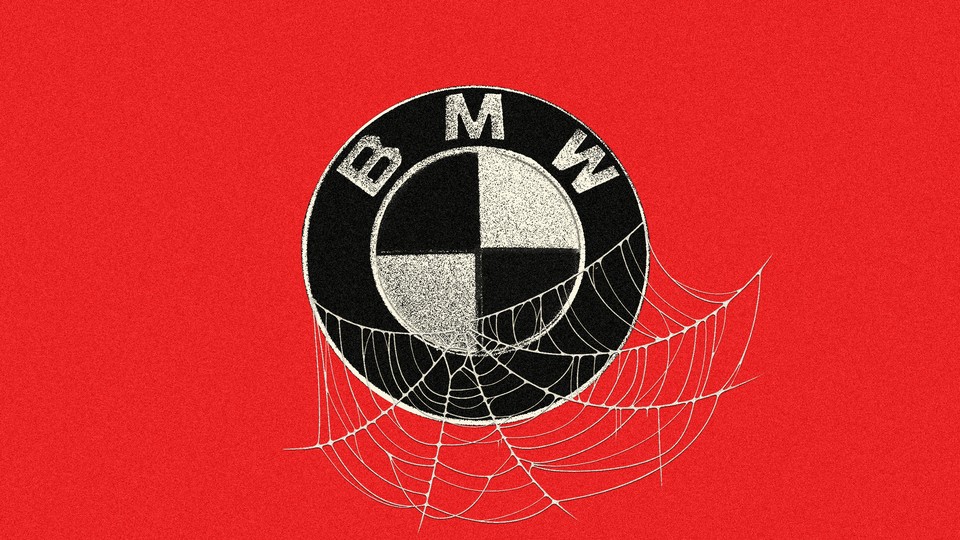 An image of the BMW logo covered in spiderwebs