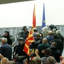 Police try to stop protesters entering Macedonia’s parliament after the governing Social Democrats and ethnic Albanian parties voted to elect an Albanian as parliament speaker in Skopje, Macedonia.