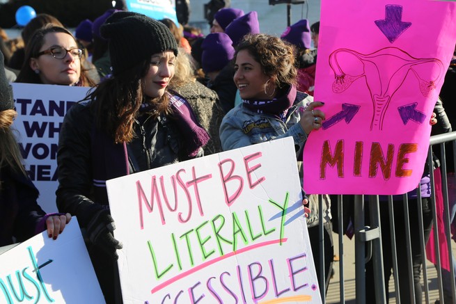 women holding signs