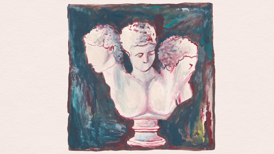 A three-headed bust