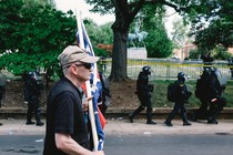 A white nationalist is seen leaving Emancipation Park in Charlottesville, Virginia, where violent clashes took place between counter-protesters and white-nationalist groups. Hundreds of white nationalist gathered at the park for a “Unite The Right” rally to protest the removal of the statue of Robert E. Lee, which is seen in the background.