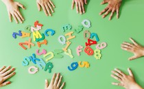 Photo of letters, kids' hands