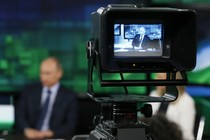 Russian President Vladimir Putin is interviewed at the headquarters of RT in Moscow.