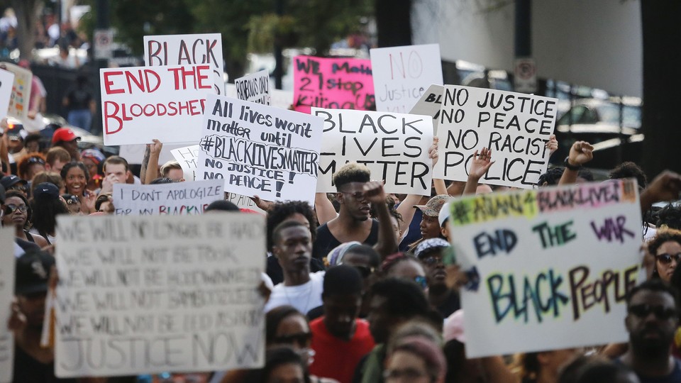 Demonstrators march through downtown Atlanta on July 8 to protest the shootings of black men by police officers.