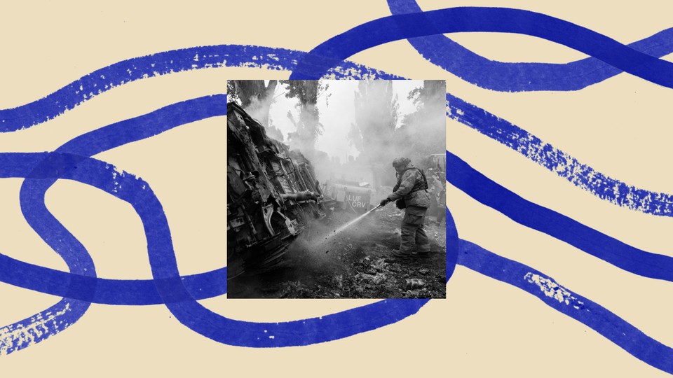 A photo of a firefighter extinguishing a burned out area in Ukraine, bordered by an illustration