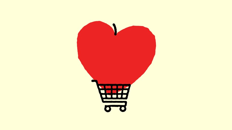 Heart shaped apple in a grocery cart