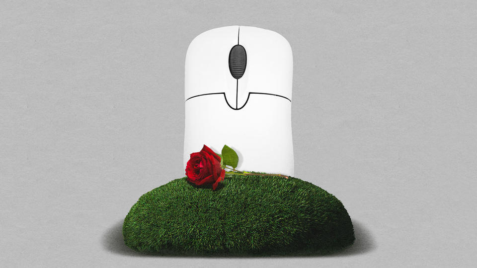 Photo-illustration of a computer mouse, rendered as a gravestone