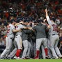 Boston Red Sox players celebrate on the field after defeating the Houston Astros on October 19.