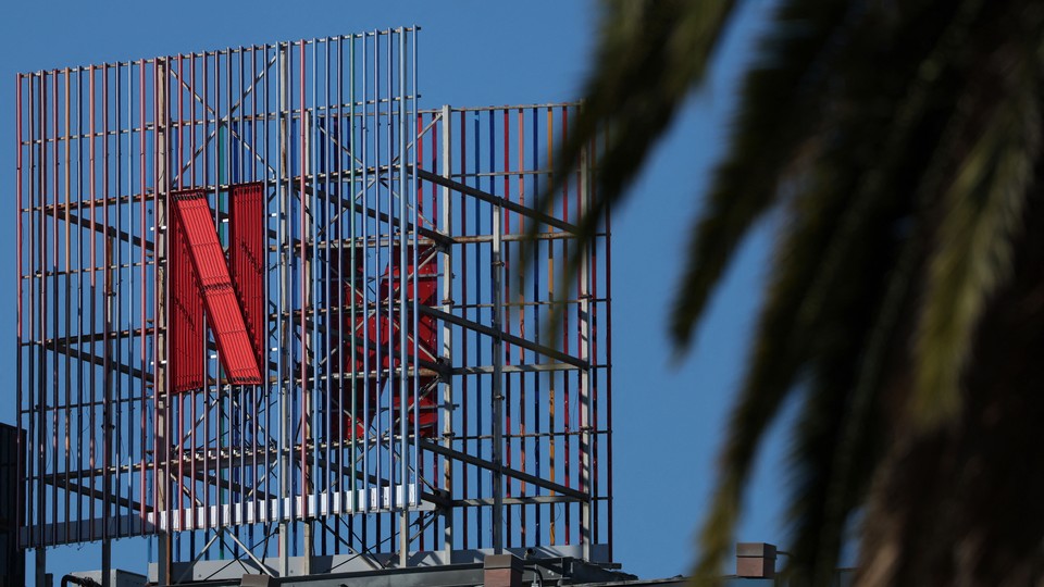 A billboard of the red Netflix 'N' in front of a blue sky