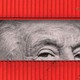 Photo illustration of Donald Trump framed by shipping containers