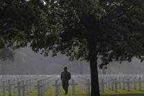 An American soldier walks in the Normandy American Cemetery on June 5, 2016.