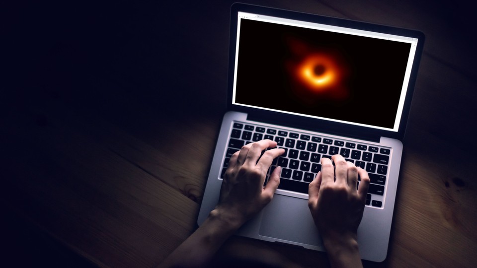 A laptop displays the famous black-hole photo.