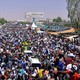 Sudanese demonstrators chant slogans during a protest in Khartoum demanding that Sudanese President Omar Al-Bashir step down.