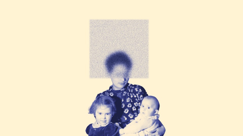 A woman holding an infant in one arm, and her other arm is around a toddler. Her face is obscured by a square made of static.