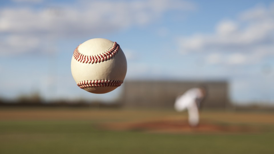 A pitcher throws a baseball