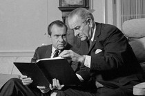 Lyndon B. Johnson and Richard Nixon speak in the Oval Office.