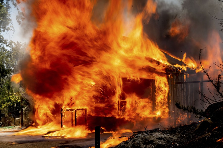 A house is engulfed in flames.