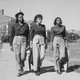 Left: Three students walk on campus at Howard University; Right: two students in class at Spelman College