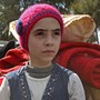 Syrian girl Noor, famous for broadcasting clips on social media about the regime-bombardments on the former rebel-held town of Jobar in Eastern Ghouta, arrives in Qalaat al-Madiq after being evacuated from Arbin on March 30, 2018.