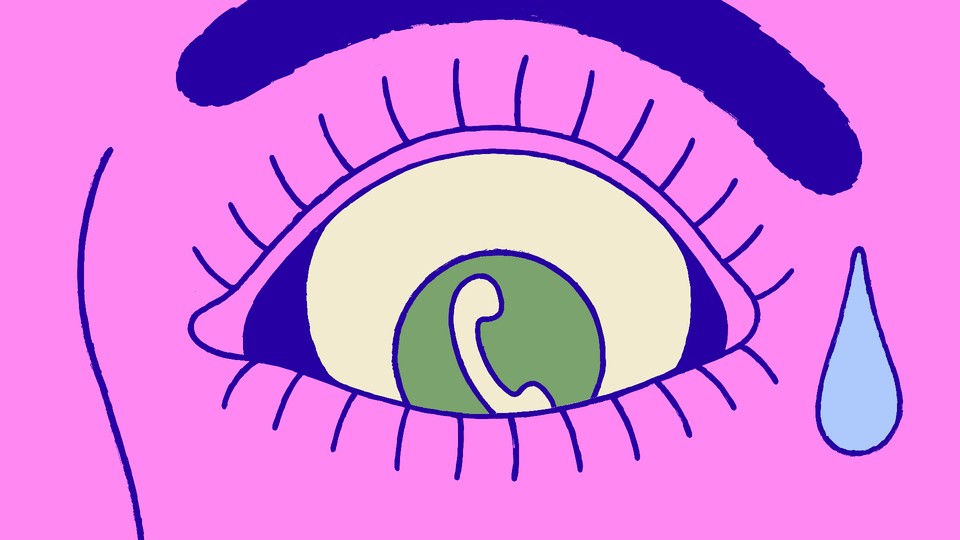 A scared-looking eye with a phone in the iris
