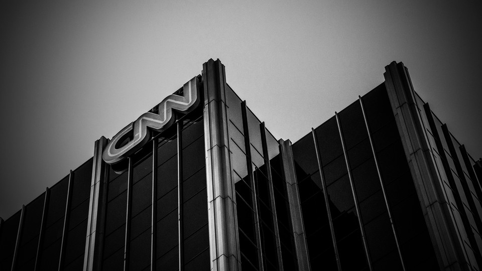 A black-and-white image of a CNN building