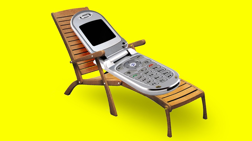 A flip phone lying on a deck chair (like a person)