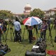 Journalists stand outside India's Supreme Court in New Delhi.