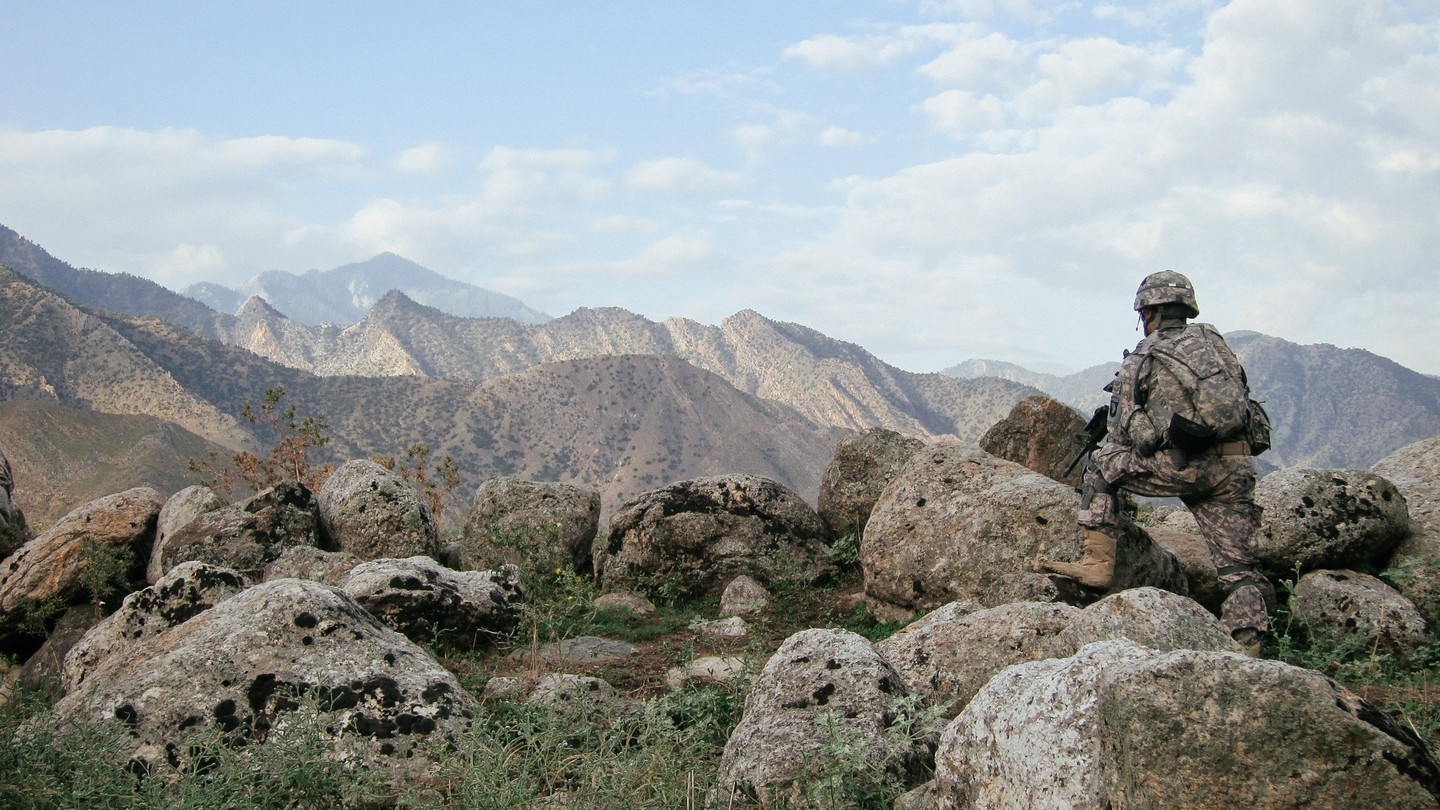 A soldier from the 101st Airborne Division patrols the Pech Valley in 2010.