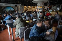 People sitting in Garage Cafe in Beijing, a meet-up space for investors and entrepreneurs