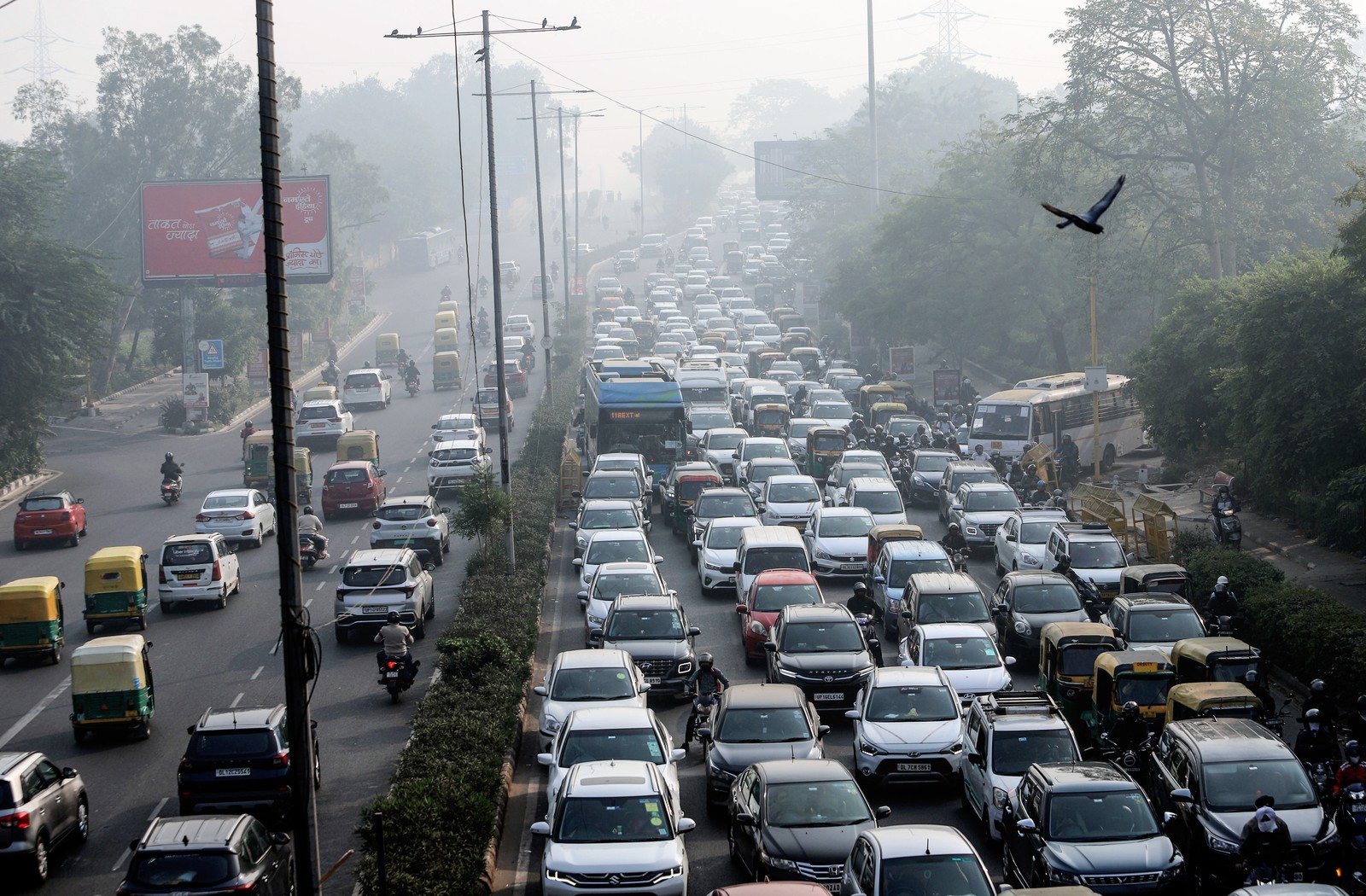 An elevated view of a busy road choked with traffic