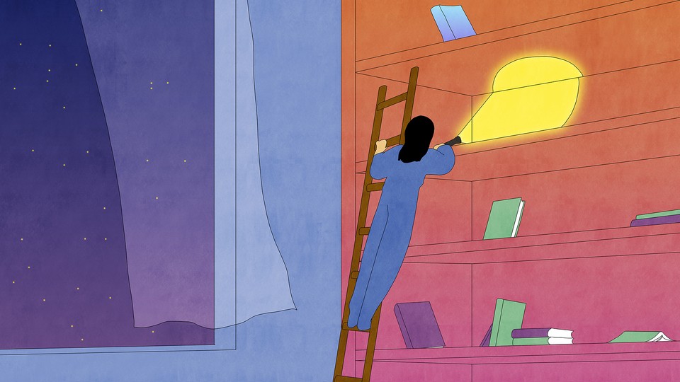 A woman on a ladder searching an almost empty bookshelf for a book